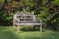 Recreation area and old wooden bench in tropical garden. Ubud, island Bali, Indonesia Royalty Free Stock Photo