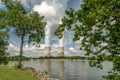 Recreation area park with nuclear cooling towers with reflection Royalty Free Stock Photo