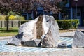 A recreation area with a stone fountain next to a residential building. Royalty Free Stock Photo