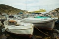 Recreation on a boat at the shore of a beautiful mountain. Yachts and boats in the beautiful Bay of Balaklava. Picturesque fishing