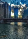 Recreation on the Chicago River as the sky reflects the sunset and buildings