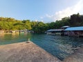 A Recreation Place with Reastaurants on Clear Sea Water and Tourism Boats