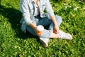 Recreation, relaxation, coffee break outdoors concept. Top view of young woman in casual with disposable cup of coffee