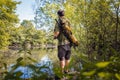 Recreational fisherman at river bank Royalty Free Stock Photo