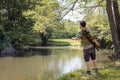 Recreational fisherman at river bank Royalty Free Stock Photo