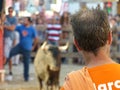 Recreational moment of people at a bullfight in representation of the traditional festivities of the cap and green