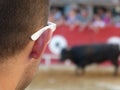 Recreational moment of people at a bullfight in representation of the traditional festivities of the cap and green