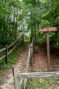 Recreational picnic area direction sign and path to the woods Royalty Free Stock Photo