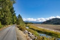 A Recreational trail passes between the woods an a small stream on a sunny Autumn day. Royalty Free Stock Photo