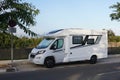 A Recreational Vehicle, Parked on the side of the Road