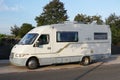 A Recreational Vehicle, RV, Parked on the side of a Road