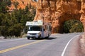 Recreational vehicle traveling through Red Arch, Bryce Canyon, Utah, USA