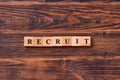 RECRUIT Word Written In Wooden Cube. Online recruitment and job search management business concept