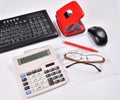 Recruitment for accountant: invoice, keyboard, calculator, mouse, hole punch, glasses and red pen Royalty Free Stock Photo