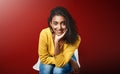 Recruitment, portrait or Indian girl in waiting room for hr meeting, help or career choice advice on red background Royalty Free Stock Photo