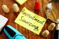 Recruitment Sourcing sign and magnifying glass