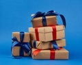 Rectangle box wrapped in brown kraft paper and tied with a silk blue and red ribbon Royalty Free Stock Photo