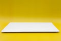A rectangle empty white plate isolated on the yellow background Royalty Free Stock Photo