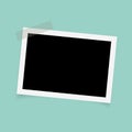 Rectangle photo frames with sticky tape on green background. Royalty Free Stock Photo