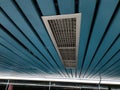 Air Ventilation Grille on Modern Blue Ceiling with Red Maintenance Tag Royalty Free Stock Photo