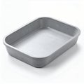 Shiny aluminum baking pan, showcasing its sleek, contemporary appearance on white background Royalty Free Stock Photo