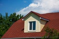 Rectangular attic window made of siding on the roof top of the h Royalty Free Stock Photo