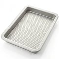 Rectangular Baking Pan with Hexagonal Patterned Liner on White sheet pan cookie sheet Royalty Free Stock Photo