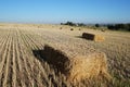 Rectangular bale of straw in the field Royalty Free Stock Photo