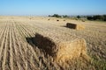 Rectangular bale of straw in the field Royalty Free Stock Photo
