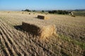 Rectangular bale of straw in the field Royalty Free Stock Photo