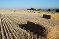 Rectangular bale of straw in the field Royalty Free Stock Photo