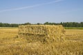 Rectangular bale of straw in the field Royalty Free Stock Photo