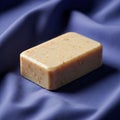 Bar of soap with a creamy beige color speckled with small, textured Royalty Free Stock Photo