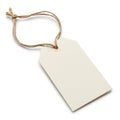 Rectangular beige paper tag with a reinforced hole, attached to a thin brown jute strin Royalty Free Stock Photo
