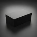 A rectangular black box with a lid, placed on a smooth, dark surface. The lighting creates a subtle Royalty Free Stock Photo