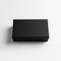 A rectangular black box, placed on a white surface, appears closed Royalty Free Stock Photo