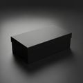 Rectangular black box with a smooth surface, sitting on a dark gradient background. The box has a Royalty Free Stock Photo