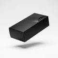 Rectangular black cardboard box with a minimalist design, featuring sharp edges and a smooth matte Royalty Free Stock Photo
