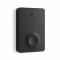 Rectangular black device with rounded edges, featuring a prominent circular button at Royalty Free Stock Photo