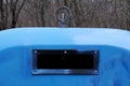 Rectangular black hole, an opening in the blue bins for separate disposal of garbage. Cleanliness in the city, garbage disposal