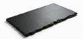Rectangular black slate platter isolated on white background. Natural stone board for serving food, cheese, desserts. Rustic yet Royalty Free Stock Photo