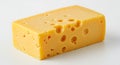 A rectangular block of yellow Swiss cheese with multiple round holes of varying