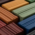 Rectangular blocks of colorful modeling clay arranged in a grid pattern. Each block Royalty Free Stock Photo