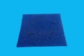 A rectangular blue plastic mat with a rough texture, used for cleaning feet. Royalty Free Stock Photo