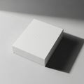 Rectangular box with a clean, minimalist design, placed on a smooth Royalty Free Stock Photo