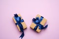 Rectangular box wrapped in brown paper and tied with a blue silk ribbon with a bow Royalty Free Stock Photo