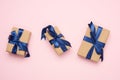 Rectangular box wrapped in brown paper and tied with a blue silk ribbon with a bow Royalty Free Stock Photo