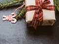 Rectangular box wrapped in brown paper and tied with a red silk ribbon with a bow Royalty Free Stock Photo