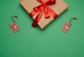 Rectangular box wrapped in brown paper and tied with a silk red ribbon with a bow Royalty Free Stock Photo