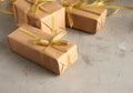 Rectangular box wrapped in brown paper and tied with a silk ribbon with a bow Royalty Free Stock Photo